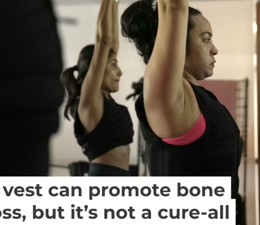 Jannelliz Barragan, center, wears a weighted vest during a workout class in New York on Aug. 13, 2025. AP Photo/Shelby Lum